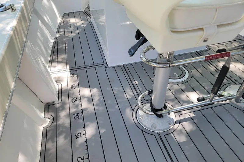 Slide: The Image of 1978 Wellcraft V-20 Steplift boat deck with seating and measurement markings. - 6
