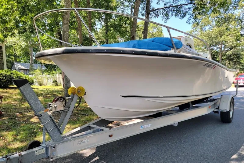 Slide: The Image of 1978 Wellcraft V-20 Steplift boat on trailer, parked on a sunny street. - 4