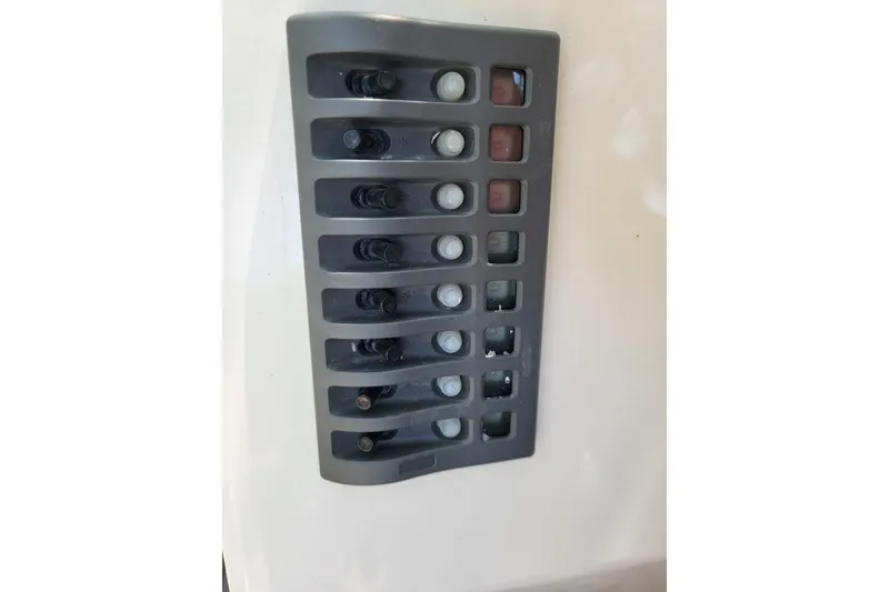 Slide: The Image of Control panel of a 1978 Wellcraft V-20 Steplift boat with multiple switches. - 15