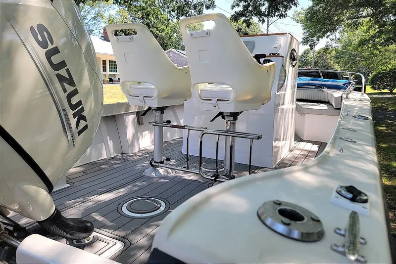 Slide: The Image of 1978 Wellcraft V-20 Steplift boat interior with Suzuki engine and dual white seats. - 5