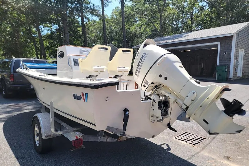 Slide: The Image of 1978 Wellcraft V-20 Steplift boat with Suzuki outboard motor on trailer. - 2