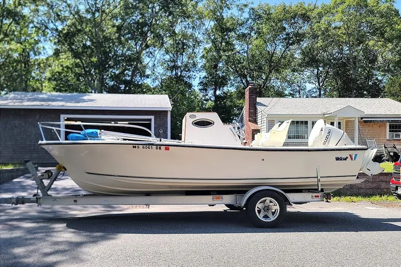 Slide: The Image of 1978 Wellcraft V-20 Steplift boat on trailer, parked in residential area. - 19