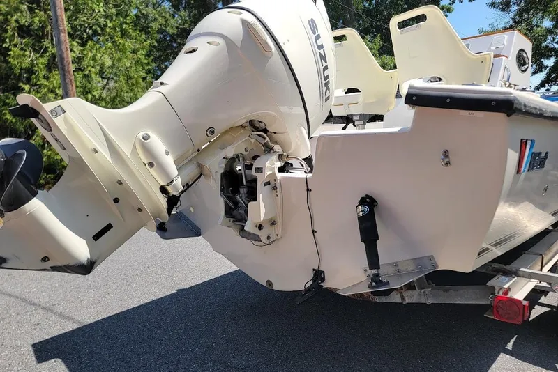 Slide: The Image of 1978 Wellcraft V-20 Steplift boat with Suzuki outboard motor on trailer. - 22