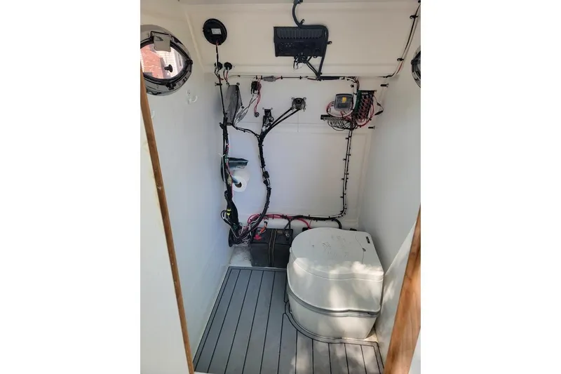 Slide: The Image of 1978 Wellcraft V-20 Steplift boat interior with wiring and equipment. - 3