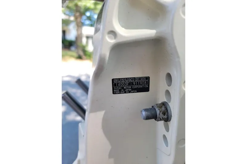 Slide: The Image of Close-up of a Suzuki DF140A engine part on a 1978 Wellcraft V-20 Steplift boat. - 23