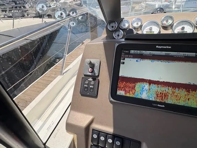Slide: The Image of Control panel of a 2013 Jeanneau NC11 boat with navigation equipment. - 9
