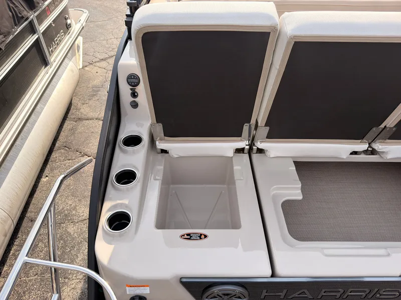 Slide: The Image of Rear view of a Harris Grand Mariner 230 with cup holders and cushioned seats. - 41