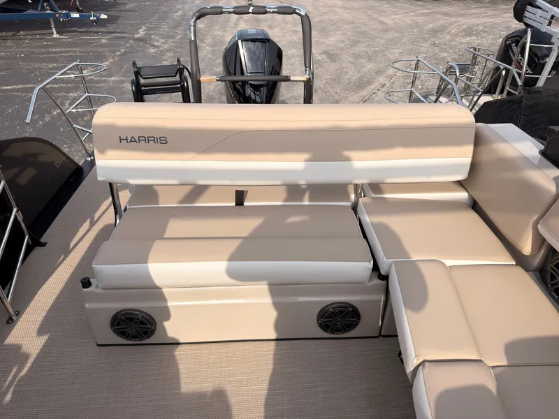 Slide: The Image of The image shows the beige seating area of a Harris Grand Mariner 230 boat. - 37