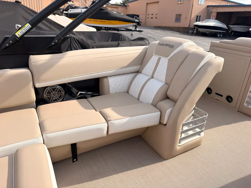 Slide: The Image of The image shows the interior of a 2027 Harris Grand Mariner 230 with beige upholstery. - 36