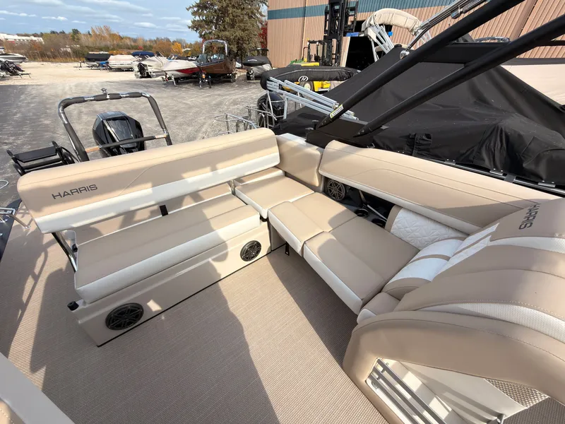 Slide: The Image of The image shows the beige interior of a 2027 Harris Grand Mariner 230. - 35