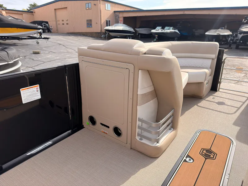 Slide: The Image of The image shows the interior of a 2027 Harris Grand Mariner 230 with beige seating. - 24