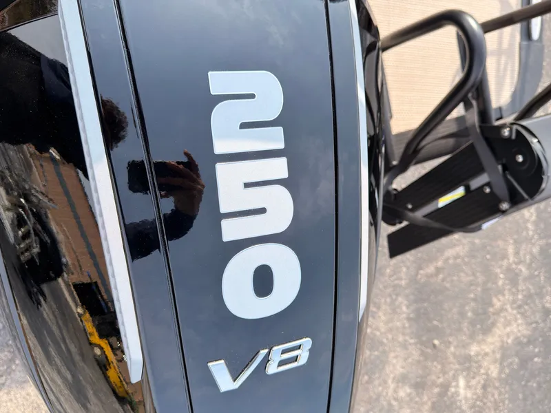 Slide: The Image of Close-up of a 250 V8 outboard motor, glossy black with large white numbers. - 47