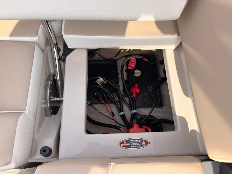 Slide: The Image of An open storage compartment with cables and connectors in a boat. - 43