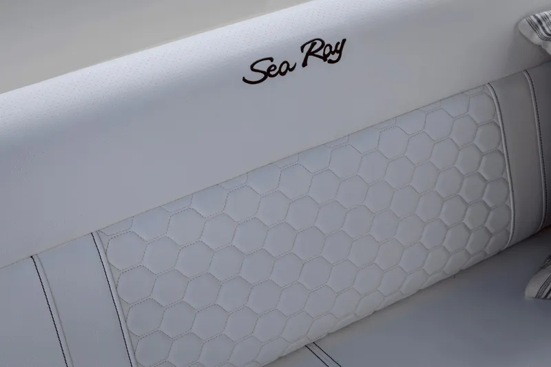 Slide: The Image of Detail of white upholstery with Sea Ray logo on the backrest. - 17