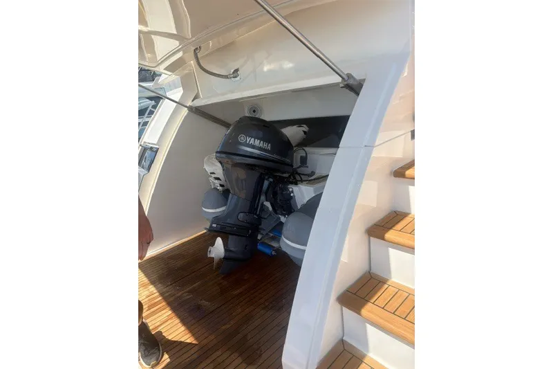 Slide: The Image of A Yamaha outboard motor is visible on a boat with a wooden deck and stairs. - 1