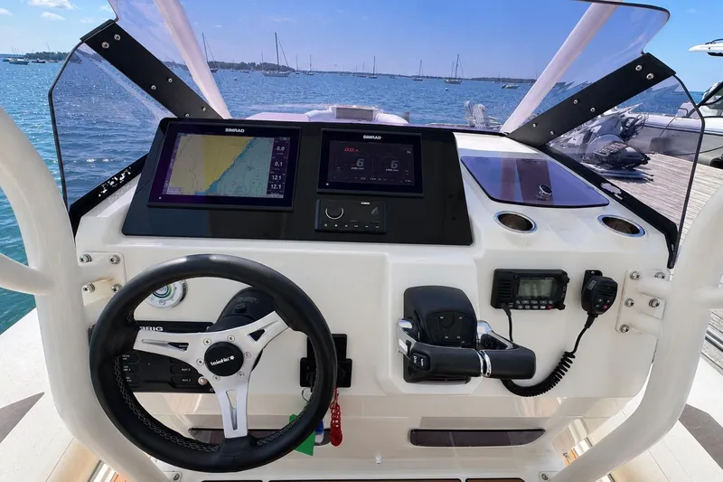 Slide: The Image of Cockpit of 2021 Brig Eagle 10 boat with navigation screens and steering wheel. - 17