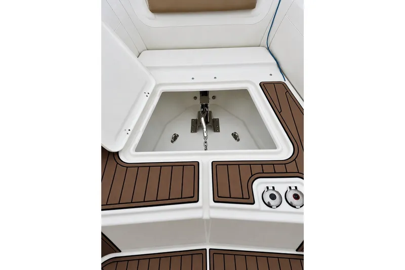 Slide: The Image of 2021 Brig Eagle 10 boat anchor compartment with teak flooring. - 9