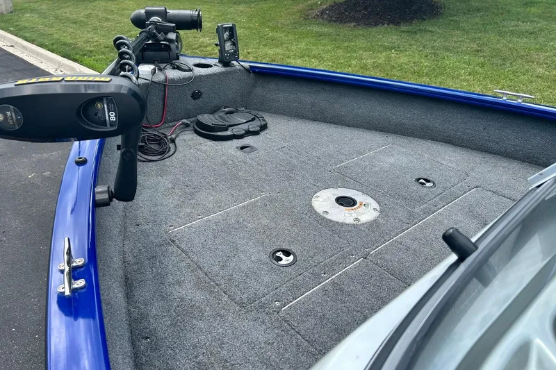 Slide: The Image of 2018 Tracker Pro Guide V-16 WT boat deck with trolling motor and fishing equipment. - 5