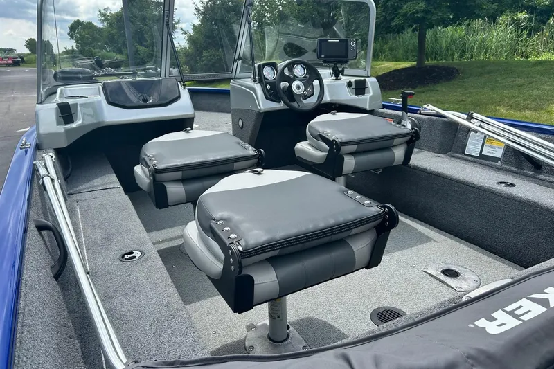 Slide: The Image of 2018 Tracker Pro Guide V-16 WT boat interior with seating and steering console. - 6