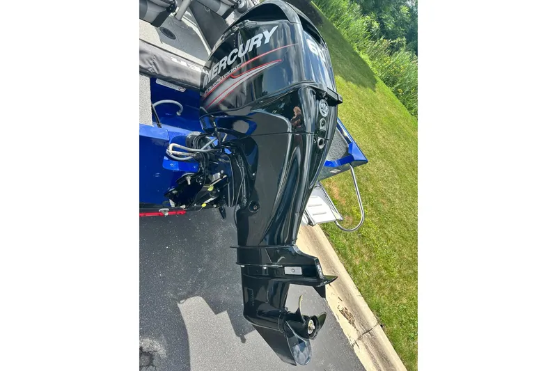 Slide: The Image of 2018 Tracker Pro Guide V-16 WT with Mercury outboard motor on a trailer. - 12