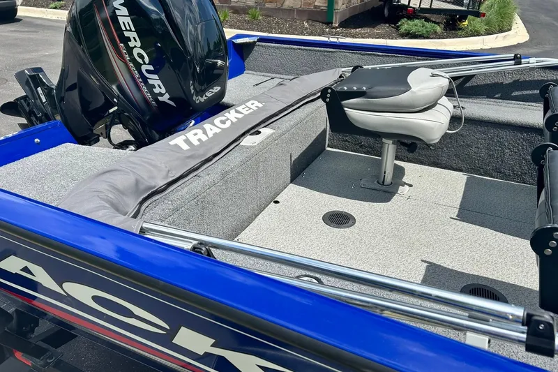 Slide: The Image of 2018 Tracker Pro Guide V-16 WT boat interior with Mercury engine and seating. - 10