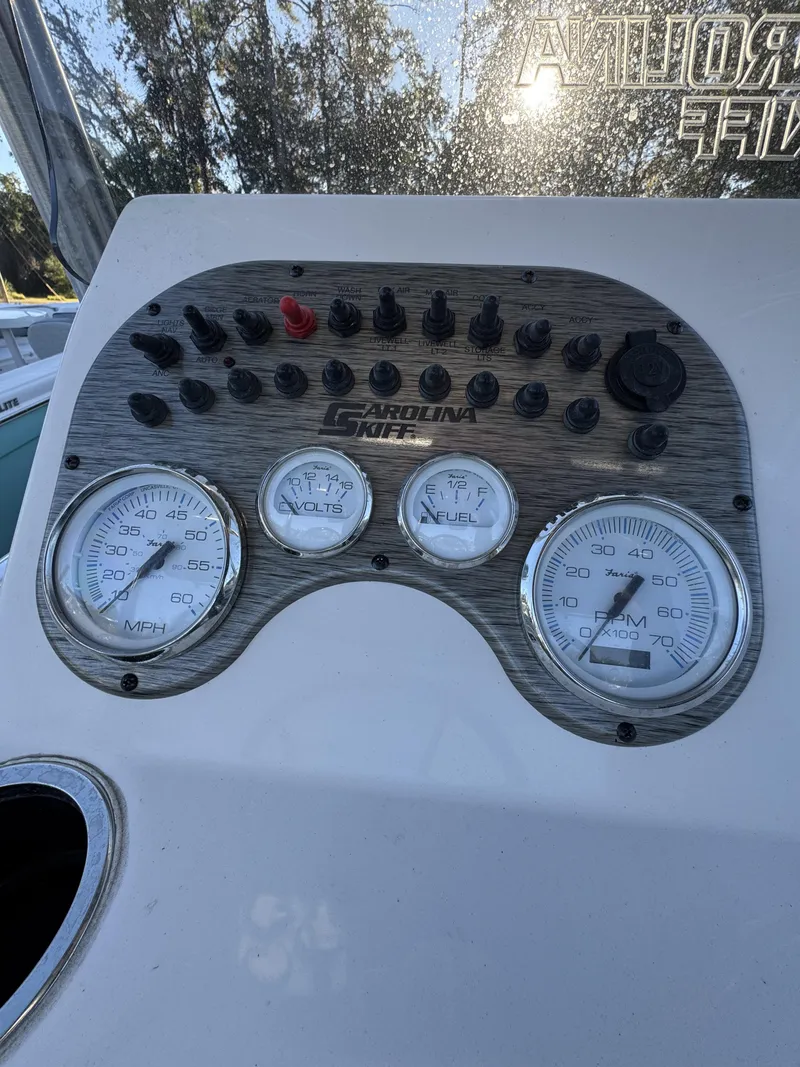 Slide: The Image of Dashboard of a 2026 Carolina Skiff 23 LS with speed and RPM gauges. - 15
