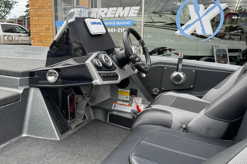 Slide: The Image of 2020 Ranger Z175 boat interior with steering wheel and control panel. - 11