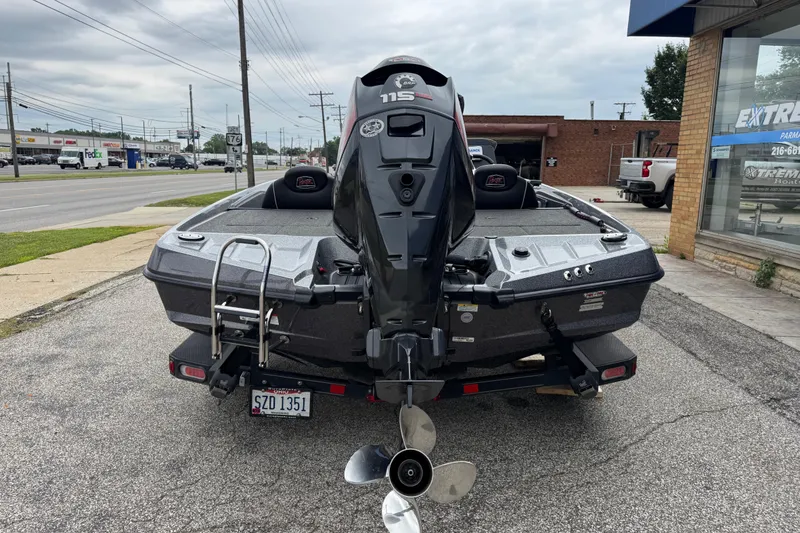 Slide: The Image of 2020 Ranger Z175 boat with 115 HP motor parked on a street. - 3