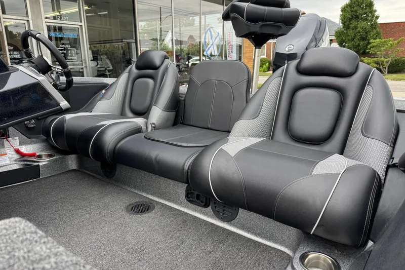 Slide: The Image of 2020 Ranger Z175 boat interior with black leather seats and steering wheel. - 10