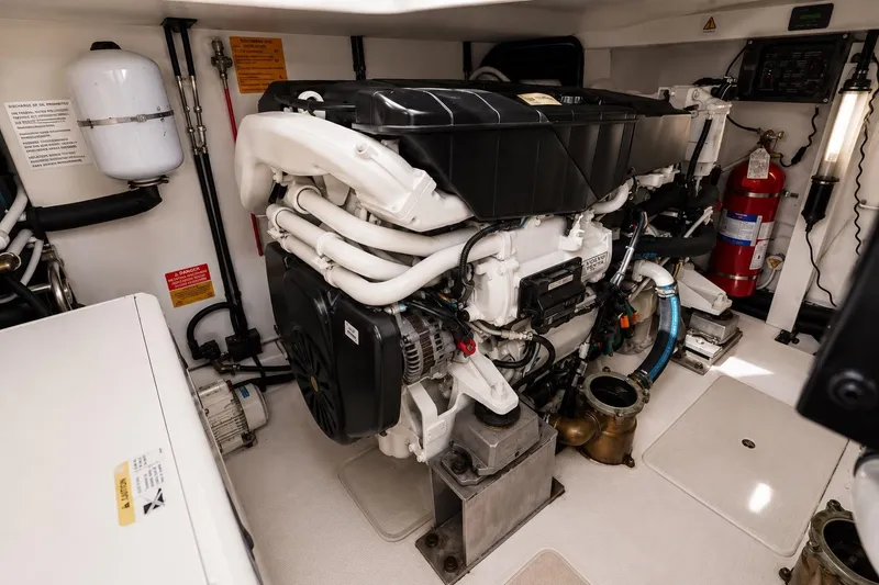 Slide: The Image of Engine room of a 2016 Azimut 50 yacht, showcasing detailed mechanical components. - 45