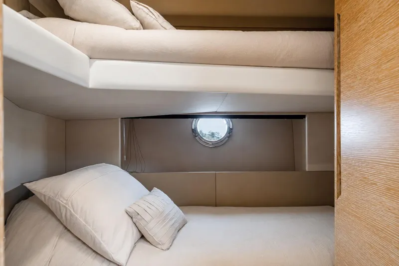 Slide: The Image of Bunk beds in 2016 Azimut 50 yacht cabin with porthole window. - 30