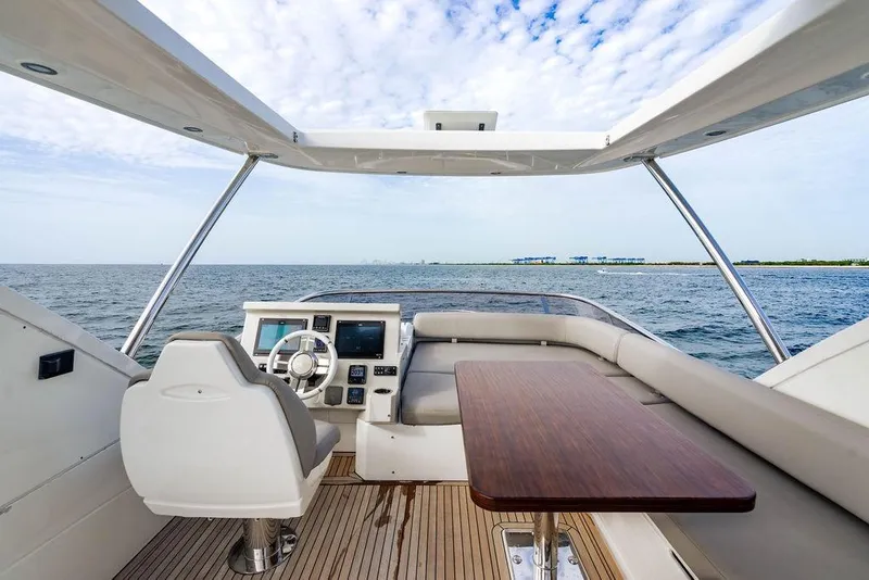 Slide: The Image of Flybridge view of 2016 Azimut 50 yacht with ocean backdrop. - 38