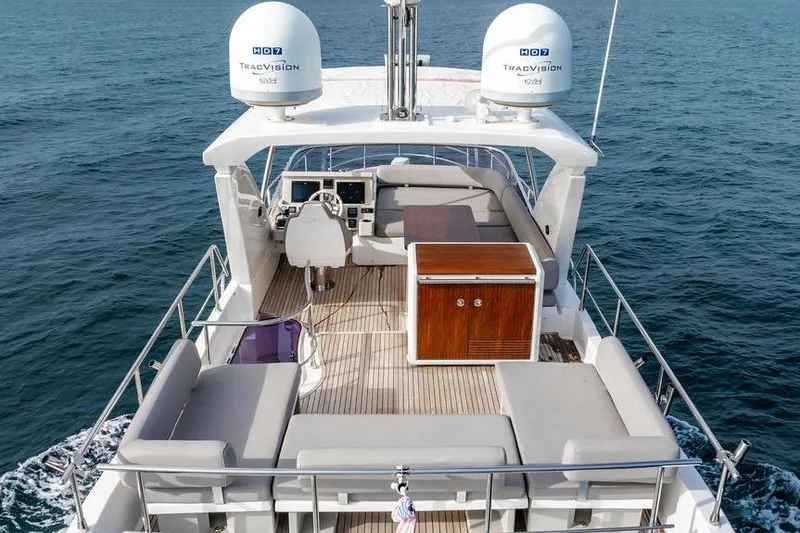 Slide: The Image of Flybridge view of 2016 Azimut 50 yacht with seating and navigation equipment. - 6