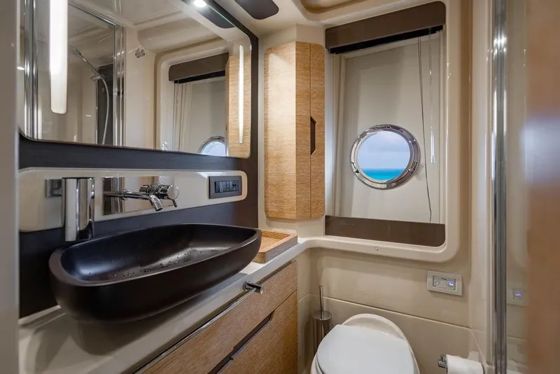 Slide: The Image of Luxurious bathroom interior of 2016 Azimut 50 yacht with modern fixtures and ocean view. - 24