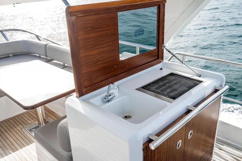 Slide: The Image of Outdoor kitchen on 2016 Azimut 50 yacht with sink and grill, overlooking the ocean. - 36