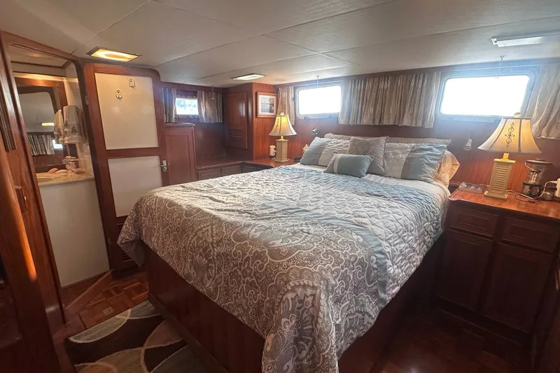 Slide: The Image of Luxurious bedroom in 1989 Jefferson Marquessa 52 yacht with elegant bedding and warm lighting. - 30