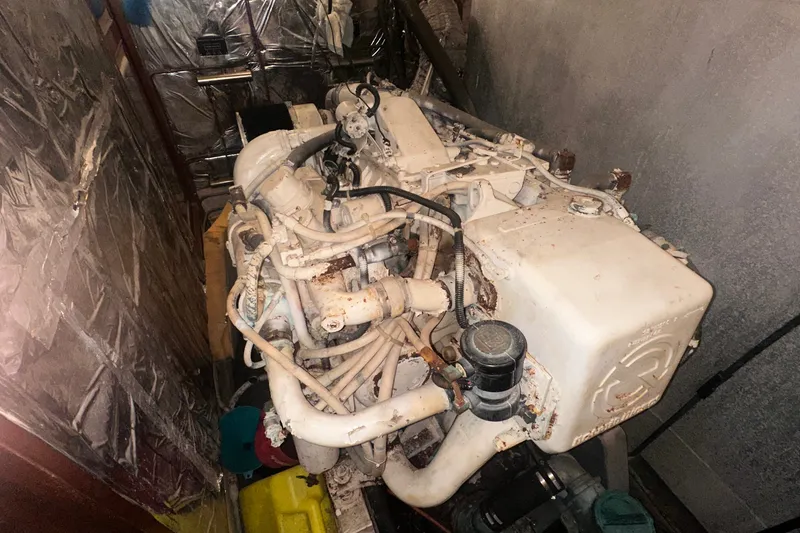 Slide: The Image of Engine room of 1989 Jefferson Marquessa 52 Extended Deckhouse yacht, showing machinery and components. - 42