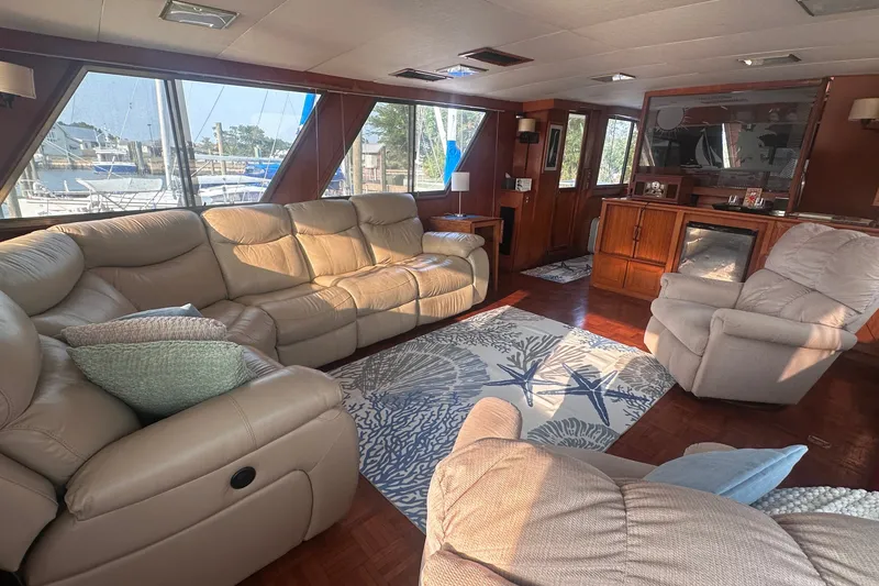 Slide: The Image of Luxurious interior of 1989 Jefferson Marquessa 52 yacht with plush seating and nautical decor. - 12