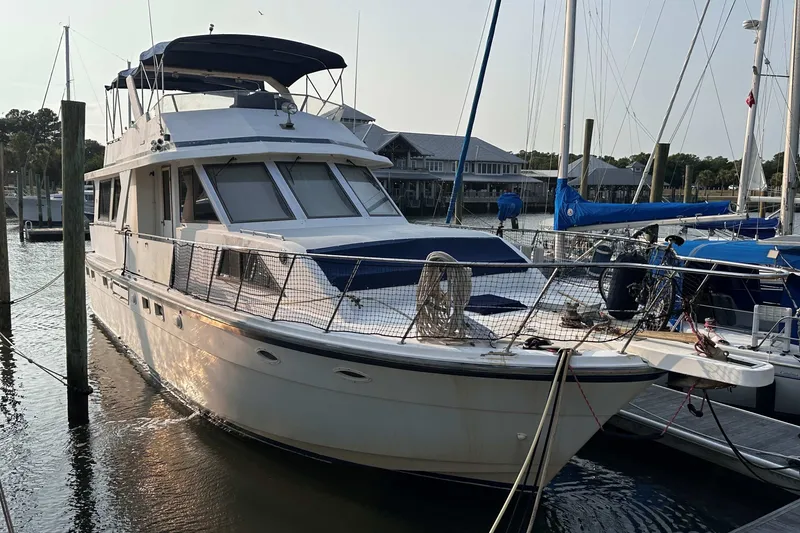 Slide: The Image of 1989 Jefferson Marquessa 52 Extended Deckhouse yacht docked at marina. - 1