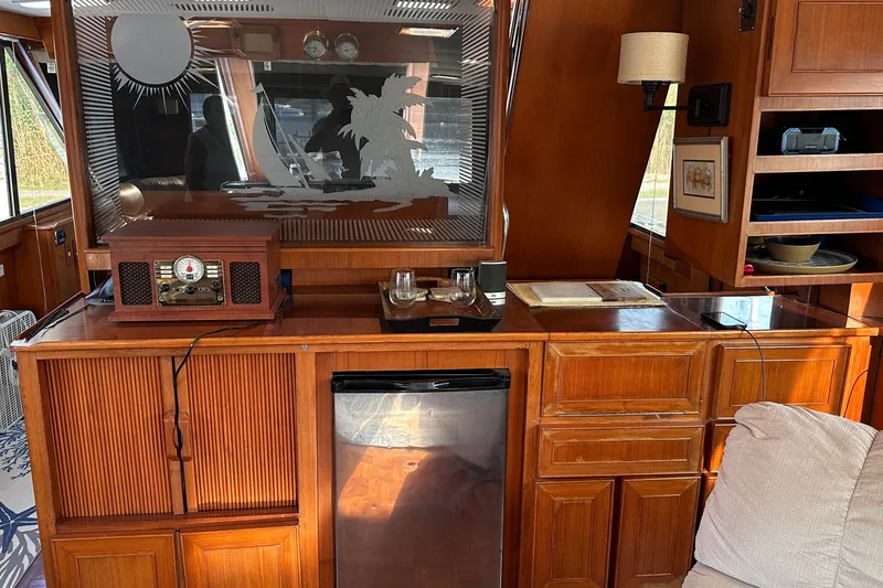Slide: The Image of Interior of 1989 Jefferson Marquessa 52 yacht with vintage decor and wooden cabinetry. - 14