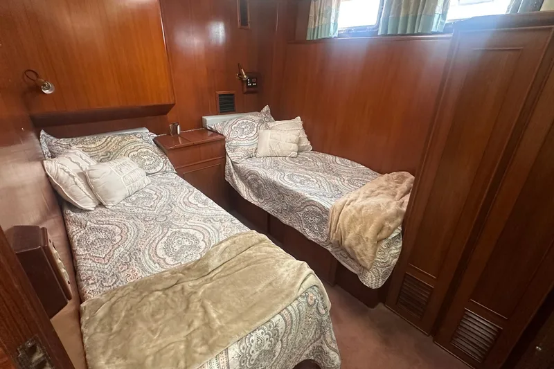 Slide: The Image of Cozy twin cabin with wood paneling in 1989 Jefferson Marquessa 52 yacht. - 27