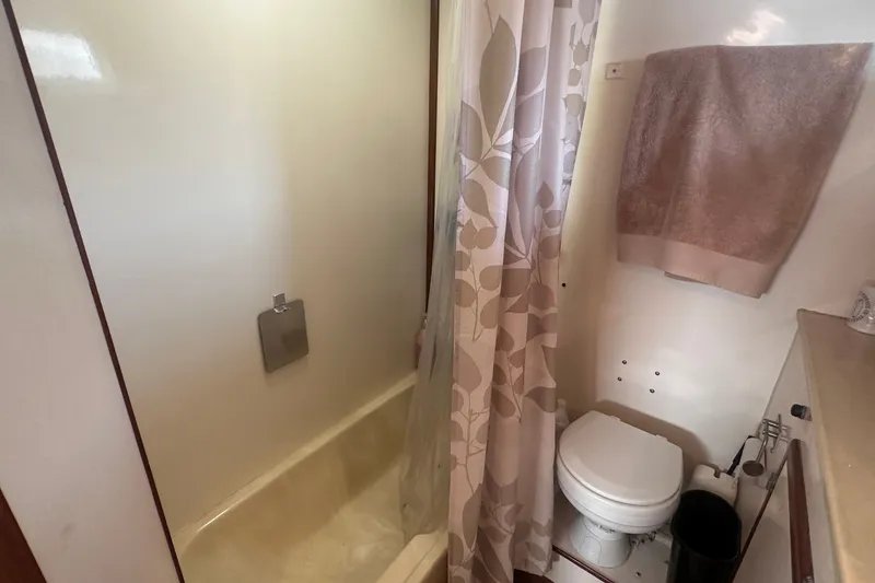 Slide: The Image of Bathroom interior of 1989 Jefferson Marquessa 52 yacht, featuring shower and toilet. - 33