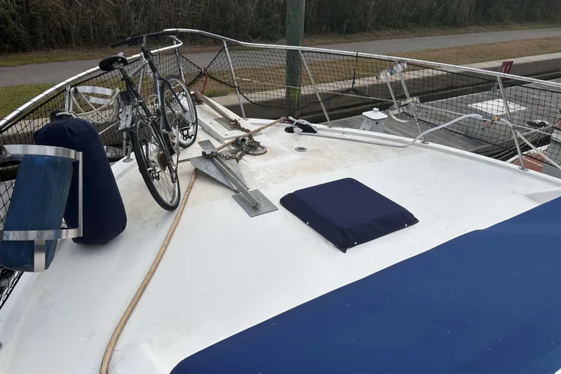 Slide: The Image of Deck of 1989 Jefferson Marquessa 52 yacht with bicycle and anchor. - 4