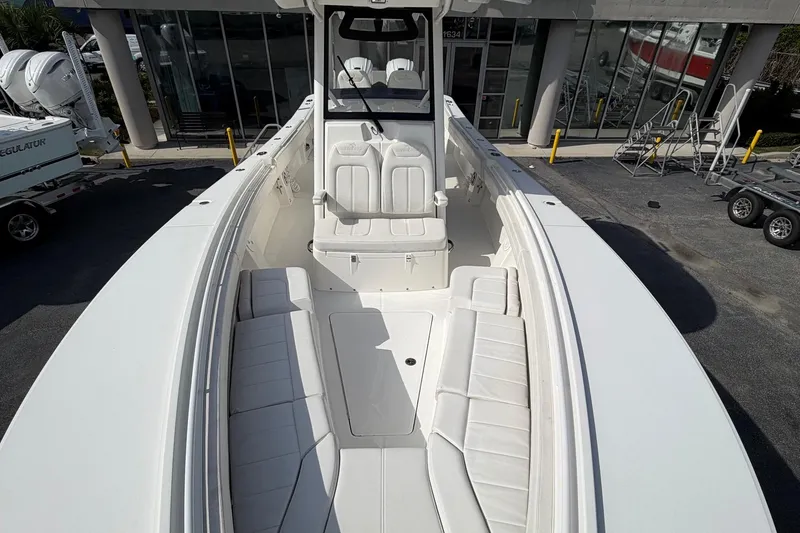 Slide: The Image of 2023 Regulator 31 boat with spacious seating and sleek design. - 11
