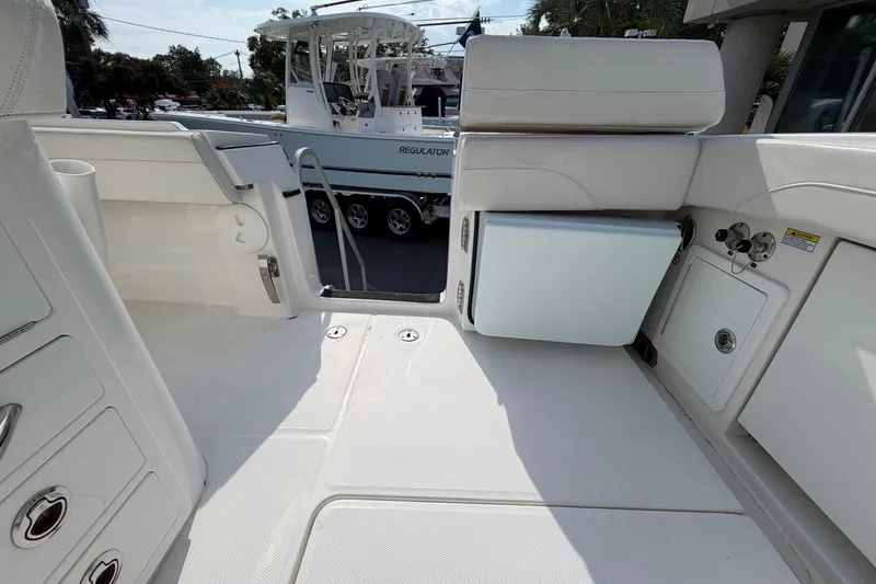 Slide: The Image of 2023 Regulator 31 boat interior with seating and storage compartments. - 25