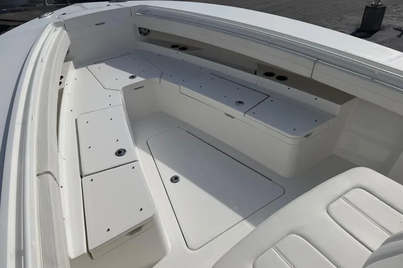 Slide: The Image of 2023 Regulator 31 boat interior with spacious seating and storage compartments. - 30