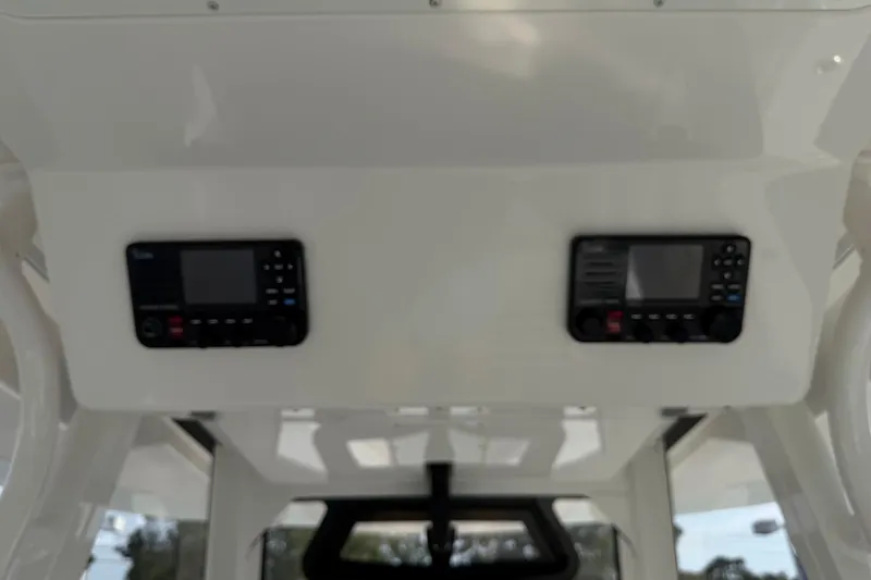 Slide: The Image of 2023 Regulator 31 boat dashboard with dual electronic displays. - 16
