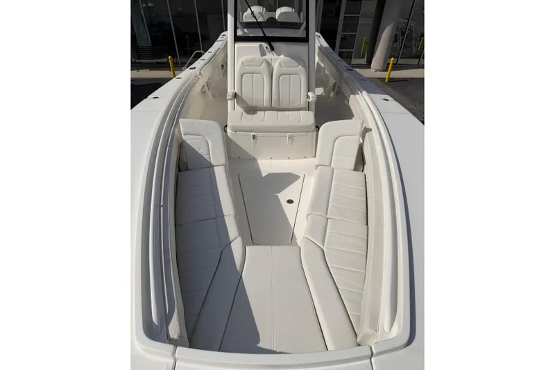 Slide: The Image of 2023 Regulator 31 boat interior with white seating and spacious layout. - 27