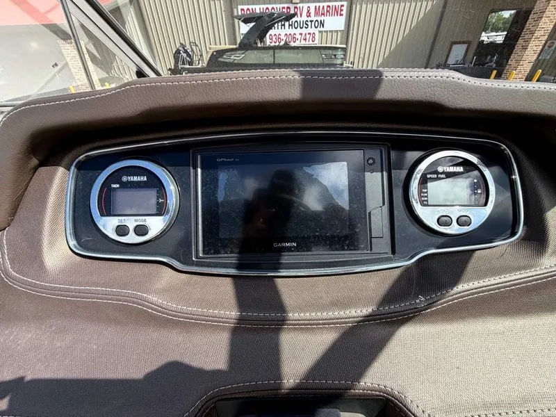 Slide: The Image of The image shows a boat cockpit with a Garmin display and two Yamaha instruments. - 14