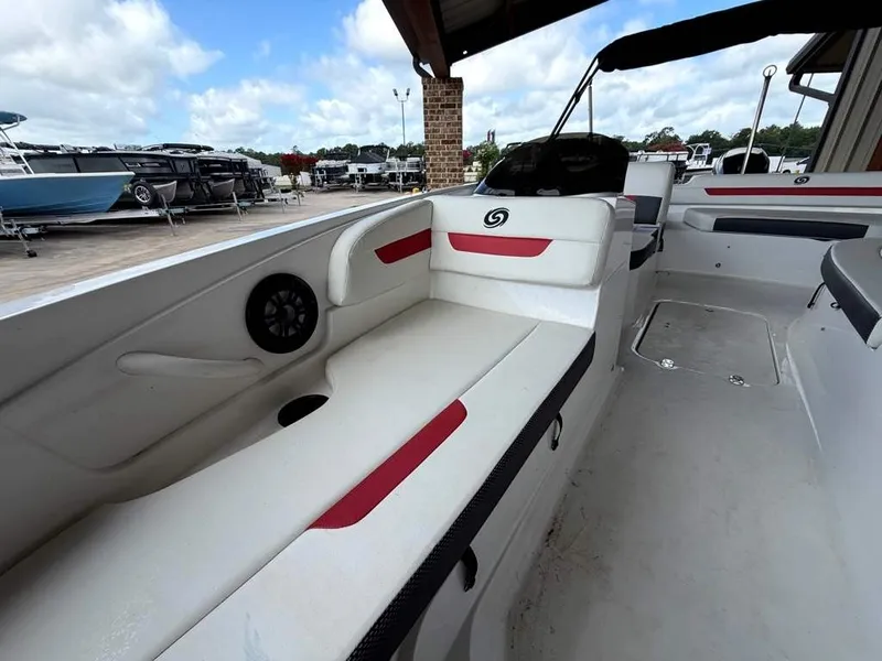 Slide: The Image of The image shows the interior of a 2020 Godfrey boat with white and red seating. - 16